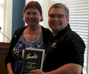 Foundry Education Foundation Board Chair Kathy Hayrynen (Applied Processes) presents Recognition Award to John Grahek at Annual Board Meeting